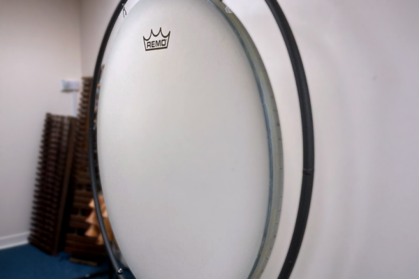 The Gong Drum is an imposting 60-inch drum. Suspended within a round sleek black metal frame, the drum is free to resonate fully, its design deliberately understated so that the instrument itself commands attention.